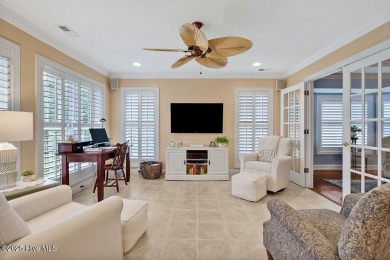 Enjoy serene pond views with this stunning brick home located in on Cape Fear National At Brunswick Forest in North Carolina - for sale on GolfHomes.com, golf home, golf lot