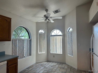 Corner lot property offering a side gate for rear access. Well on Cerbat Cliffs Golf Course in Arizona - for sale on GolfHomes.com, golf home, golf lot