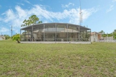 HUGE PRICE DROP! Pool home, on an acre, listed well under on Wedgefield Golf Club in Florida - for sale on GolfHomes.com, golf home, golf lot