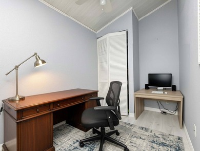 This unfurnished 2BR/1.5b park home is located on a quiet street on The Great Outdoors Golf and Country Club in Florida - for sale on GolfHomes.com, golf home, golf lot