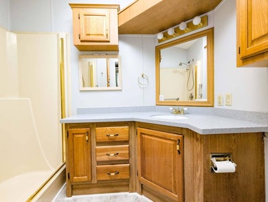 This unfurnished 2BR/1.5b park home is located on a quiet street on The Great Outdoors Golf and Country Club in Florida - for sale on GolfHomes.com, golf home, golf lot