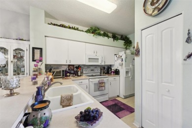 Welcome to this charming home nestled on a serene conservation on Scepter Golf Club in Florida - for sale on GolfHomes.com, golf home, golf lot