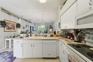 Welcome to this charming home nestled on a serene conservation on Scepter Golf Club in Florida - for sale on GolfHomes.com, golf home, golf lot
