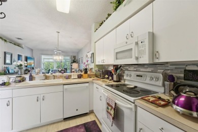 Welcome to this charming home nestled on a serene conservation on Scepter Golf Club in Florida - for sale on GolfHomes.com, golf home, golf lot