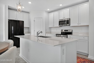 Discover your new light, bright, and delightfully modern on LPGA International Golf Course in Florida - for sale on GolfHomes.com, golf home, golf lot