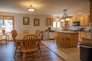 Stunning Furnished Condo on Castle Rock Lake! Discover luxury on Northern Bay Golf Resort and Marina in Wisconsin - for sale on GolfHomes.com, golf home, golf lot