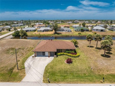 Under contract-accepting backup offers. Canalfront Home in on Rotonda Golf and Country Club The Palms Course in Florida - for sale on GolfHomes.com, golf home, golf lot