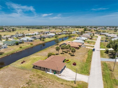 Under contract-accepting backup offers. Canalfront Home in on Rotonda Golf and Country Club The Palms Course in Florida - for sale on GolfHomes.com, golf home, golf lot