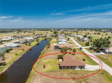 Under contract-accepting backup offers. Canalfront Home in on Rotonda Golf and Country Club The Palms Course in Florida - for sale on GolfHomes.com, golf home, golf lot