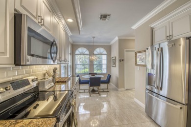Welcome to 503 Ryder Cup Cir S, a stunningly updated 3BR 2BA on PGA National Golf Club in Florida - for sale on GolfHomes.com, golf home, golf lot