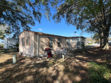 This 2/2 home will be offered fully furnished and it includes on Lake Henry Golf Club in Florida - for sale on GolfHomes.com, golf home, golf lot