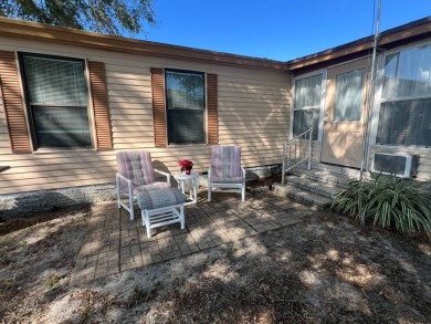 This 2/2 home will be offered fully furnished and it includes on Lake Henry Golf Club in Florida - for sale on GolfHomes.com, golf home, golf lot