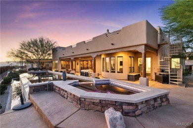 This stunning 5-bedroom, 4-bathroom custom home, built in 2011 on Laughlin Ranch Golf Club in Arizona - for sale on GolfHomes.com, golf home, golf lot