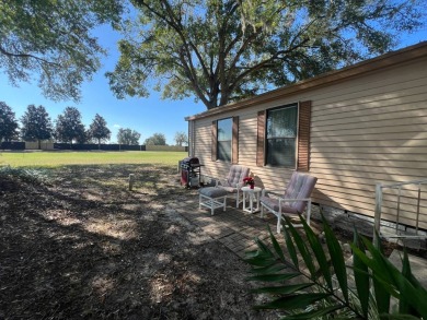 This 2/2 home will be offered fully furnished and it includes on Lake Henry Golf Club in Florida - for sale on GolfHomes.com, golf home, golf lot