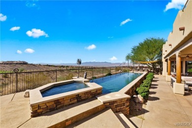 This stunning 5-bedroom, 4-bathroom custom home, built in 2011 on Laughlin Ranch Golf Club in Arizona - for sale on GolfHomes.com, golf home, golf lot