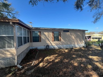 This 2/2 home will be offered fully furnished and it includes on Lake Henry Golf Club in Florida - for sale on GolfHomes.com, golf home, golf lot