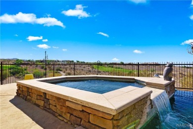 This stunning 5-bedroom, 4-bathroom custom home, built in 2011 on Laughlin Ranch Golf Club in Arizona - for sale on GolfHomes.com, golf home, golf lot