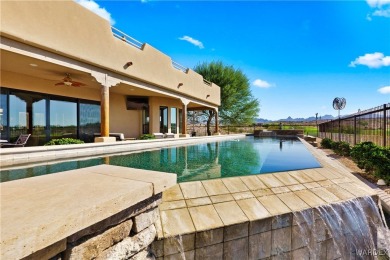 This stunning 5-bedroom, 4-bathroom custom home, built in 2011 on Laughlin Ranch Golf Club in Arizona - for sale on GolfHomes.com, golf home, golf lot