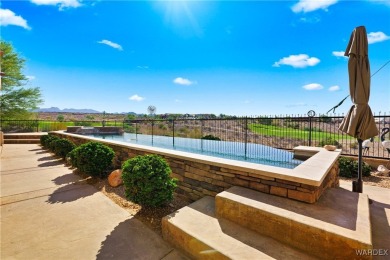 This stunning 5-bedroom, 4-bathroom custom home, built in 2011 on Laughlin Ranch Golf Club in Arizona - for sale on GolfHomes.com, golf home, golf lot