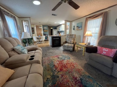 This 2/2 home will be offered fully furnished and it includes on Lake Henry Golf Club in Florida - for sale on GolfHomes.com, golf home, golf lot