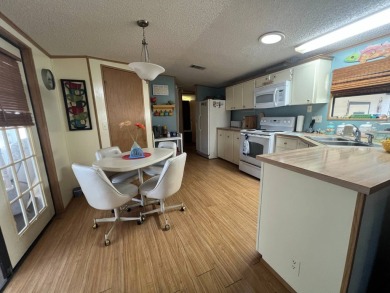 This 2/2 home will be offered fully furnished and it includes on Lake Henry Golf Club in Florida - for sale on GolfHomes.com, golf home, golf lot