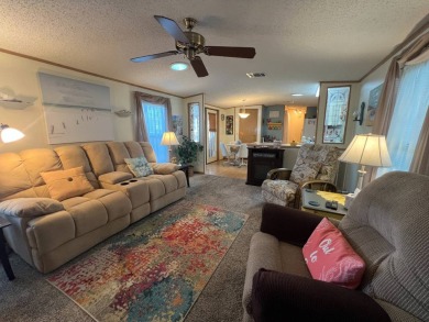 This 2/2 home will be offered fully furnished and it includes on Lake Henry Golf Club in Florida - for sale on GolfHomes.com, golf home, golf lot