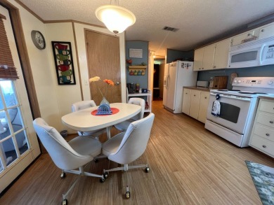 This 2/2 home will be offered fully furnished and it includes on Lake Henry Golf Club in Florida - for sale on GolfHomes.com, golf home, golf lot