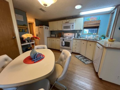 This 2/2 home will be offered fully furnished and it includes on Lake Henry Golf Club in Florida - for sale on GolfHomes.com, golf home, golf lot