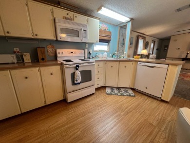 This 2/2 home will be offered fully furnished and it includes on Lake Henry Golf Club in Florida - for sale on GolfHomes.com, golf home, golf lot