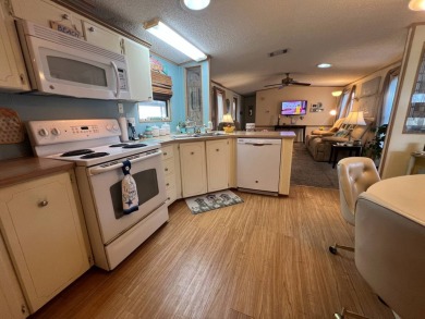 This 2/2 home will be offered fully furnished and it includes on Lake Henry Golf Club in Florida - for sale on GolfHomes.com, golf home, golf lot