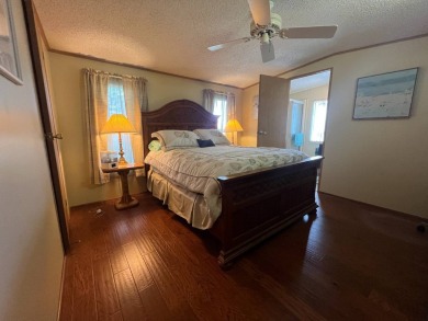 This 2/2 home will be offered fully furnished and it includes on Lake Henry Golf Club in Florida - for sale on GolfHomes.com, golf home, golf lot