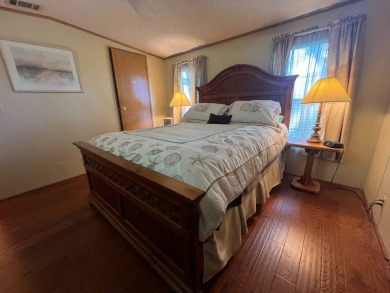 This 2/2 home will be offered fully furnished and it includes on Lake Henry Golf Club in Florida - for sale on GolfHomes.com, golf home, golf lot