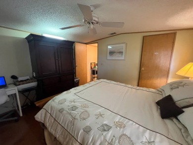 This 2/2 home will be offered fully furnished and it includes on Lake Henry Golf Club in Florida - for sale on GolfHomes.com, golf home, golf lot