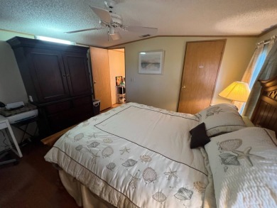 This 2/2 home will be offered fully furnished and it includes on Lake Henry Golf Club in Florida - for sale on GolfHomes.com, golf home, golf lot