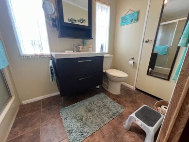 This 2/2 home will be offered fully furnished and it includes on Lake Henry Golf Club in Florida - for sale on GolfHomes.com, golf home, golf lot