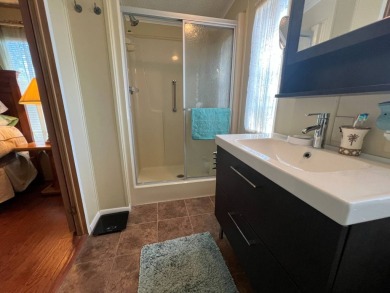This 2/2 home will be offered fully furnished and it includes on Lake Henry Golf Club in Florida - for sale on GolfHomes.com, golf home, golf lot