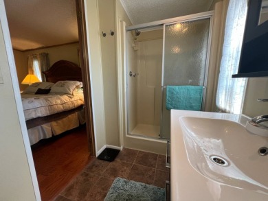 This 2/2 home will be offered fully furnished and it includes on Lake Henry Golf Club in Florida - for sale on GolfHomes.com, golf home, golf lot