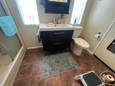 This 2/2 home will be offered fully furnished and it includes on Lake Henry Golf Club in Florida - for sale on GolfHomes.com, golf home, golf lot