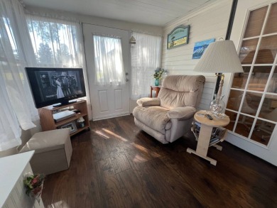 This 2/2 home will be offered fully furnished and it includes on Lake Henry Golf Club in Florida - for sale on GolfHomes.com, golf home, golf lot
