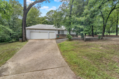 Gorgeous home nestled on over 1/2 acre lovely, wooded corner lot on Holly Lake Ranch Golf Club in Texas - for sale on GolfHomes.com, golf home, golf lot