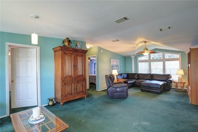 Live the Barefoot Bay lifestyle in this beautifully landscaped on Barefoot Bay Golf Course in Florida - for sale on GolfHomes.com, golf home, golf lot
