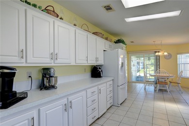 Live the Barefoot Bay lifestyle in this beautifully landscaped on Barefoot Bay Golf Course in Florida - for sale on GolfHomes.com, golf home, golf lot