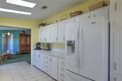 Live the Barefoot Bay lifestyle in this beautifully landscaped on Barefoot Bay Golf Course in Florida - for sale on GolfHomes.com, golf home, golf lot