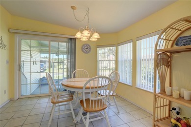 Live the Barefoot Bay lifestyle in this beautifully landscaped on Barefoot Bay Golf Course in Florida - for sale on GolfHomes.com, golf home, golf lot