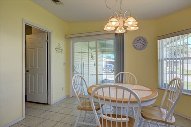 Live the Barefoot Bay lifestyle in this beautifully landscaped on Barefoot Bay Golf Course in Florida - for sale on GolfHomes.com, golf home, golf lot