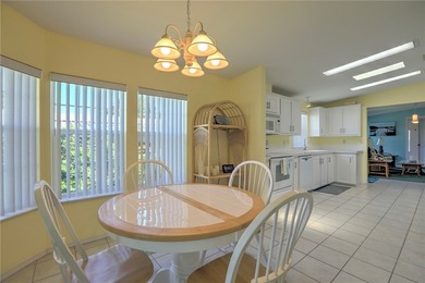 Live the Barefoot Bay lifestyle in this beautifully landscaped on Barefoot Bay Golf Course in Florida - for sale on GolfHomes.com, golf home, golf lot