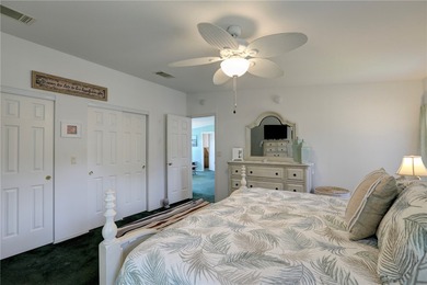 Live the Barefoot Bay lifestyle in this beautifully landscaped on Barefoot Bay Golf Course in Florida - for sale on GolfHomes.com, golf home, golf lot