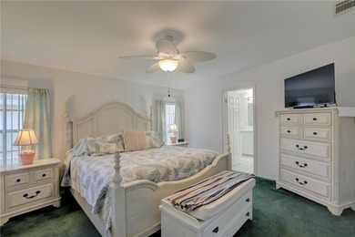 Live the Barefoot Bay lifestyle in this beautifully landscaped on Barefoot Bay Golf Course in Florida - for sale on GolfHomes.com, golf home, golf lot