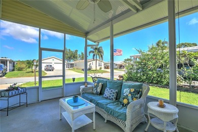 Live the Barefoot Bay lifestyle in this beautifully landscaped on Barefoot Bay Golf Course in Florida - for sale on GolfHomes.com, golf home, golf lot