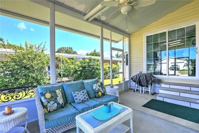 Live the Barefoot Bay lifestyle in this beautifully landscaped on Barefoot Bay Golf Course in Florida - for sale on GolfHomes.com, golf home, golf lot